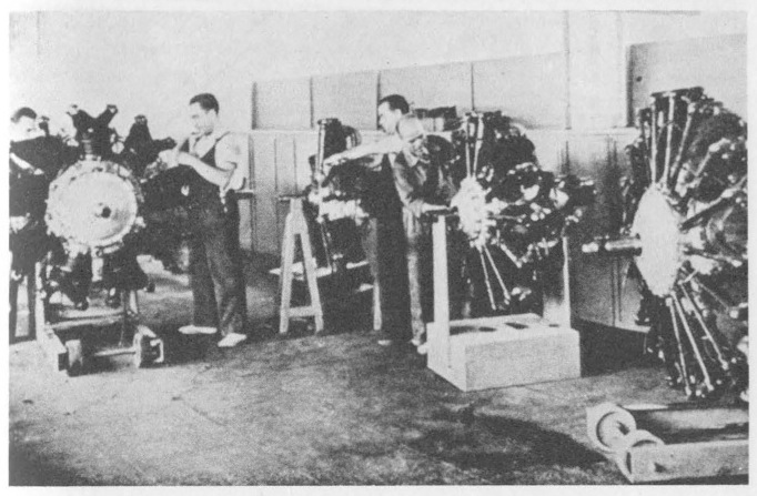 “Workers in a collectivized aircraft engine plant in Barcelona.”